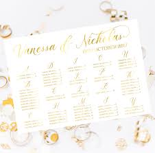 gold foil wedding sign alphabetical seating chart calligraphy