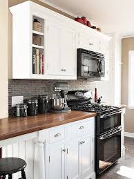 stunning white kitchen cabinets black