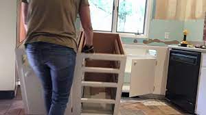 If you're reusing the screws, tape them to the inside of the doors or to the hinges. Removing Some Of The Lower Kitchen Cabinets Youtube