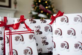 Holidays are all about spending time with the ones you love as well as giving and receiving gifts. New Wrapping Paper Features Black Santa