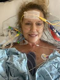 This is my beautiful wife! 22 hours after open heart surgery… that was very  successful… now the rehab begins! Gonna b some serious pain, some set  backs, some crying… both from agony