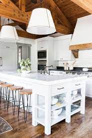 White kitchen cabinets already have an overwhelming sense of plain continuity to them due to the inherent canvas like properties of the color white. 23 White Kitchens Without Wood Floors Down Leah S Lane
