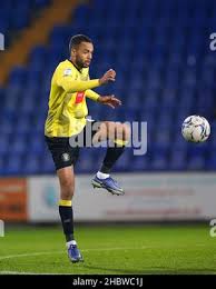 Warren Burrell (6) of Harrogate Town in action during the game Stock Photo 