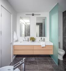 The rigid application of square and rectangular shapes is contrasted only by the curves of the faucet spouts. Your Guide To A Modern Style Bathroom