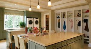 Beside them is a cubby repurposed into a doggie bed. The Retreat At Waters Edge 3236 4 Bedrooms And 6 Baths The House Designers Luxury House Plans Dream Laundry Room Home