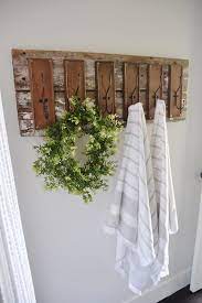 Attach your metal hooks to the wood towel rack, evenly spaced, with wood screws. 17 Rustic Towel Rack Ideas Rustic Towels Home Diy Rustic Towel Rack