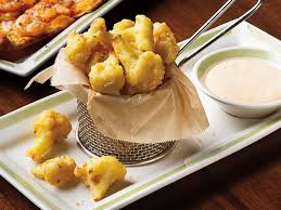 In a large bowl, combine the flour, old bay, and baking powder. Menu