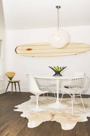 Inside A Neat Girl S Amazing Home Michigan Neat Method Cowhide Rug Dining Room Saarinen Dining Table White Dining Room