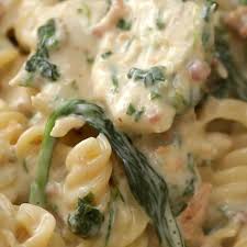 10 Creamy Satisfying Pasta Dishes Rotini Pasta Recipes Spinach Stuffed Chicken Spinach Alfredo