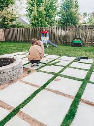 The blueboard cuts easily with a serrated knife and you can mix up a batch of soil cement in a few minutes in a wheelbarrow. Diy Patio With Grass Between Pavers And A Fire Pit