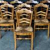 Black metal crossback farm chair with dark stain. 1