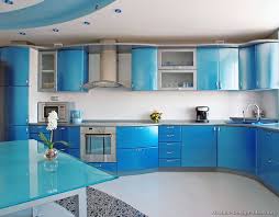 A Metallic Blue Kitchen With Modern Curved Cabinets Blue Kitchen Interior Interior Design Kitchen Blue Kitchen Designs