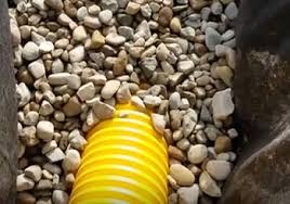Sewer and drain pipe through top cover knockout; Do Not Use Pea Gravel Pea Pebble Pea Stone When Building A French Drain French Drain Systems Curtain Drains Macomb Oakland Lapeer St Clair County