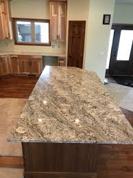Blue Jeans Granite Island With Carrara Calcatta Quartz Perimeter Fabricated And Installed By Affordable Granite Cabinetr Affordable Granite Cabinetry Granite