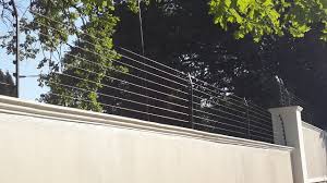 Eric thacker, shannon cromwell, kevin heaton, kohl carter installing a high tensile electric fence. Electric Fence Installations And Repairs East Rand