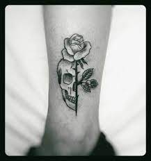 She looks half dead thanks to the tattoo and. Skull And Rose Skull Rose Tattoos Geometric Tattoo Rose Tattoos