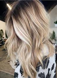 Slightly golden in tone, these blonde locks flow effortlessly down from darker roots with that extra special balayage technique that makes it look so easy. Golden Blonde Or Ash Blonde Home With A Style