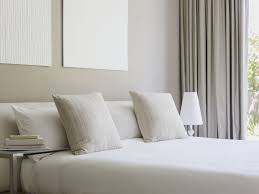 Curating a collection of art that mixes artistic style, mediums, frame colors, and sizes of the pieces gives a space a creative and unexpected feel; Feng Shui Decor Tips For A West Facing Bedroom