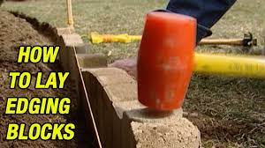 How to lay garden bricks for edging. How To Lay Edging Blocks Youtube