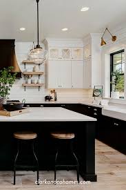 Black And White Tuxedo Cabinets Are Customized To This Spacious Modern Farmhouse Kitchen Modernfar In 2020 Home Decor Kitchen Kitchen Style Modern Farmhouse Kitchens