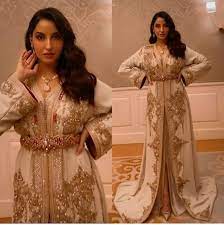 Nora fatehi is a canadian dancer, model, actress, singer, and producer who is known for her work in the indian film industry. Aishdeepalia Nora Fatehi In Moroccon Caftan In 2021 Moroccan Dress Classy Outfits Dresses
