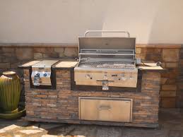 outdoor bbq island with natural stone
