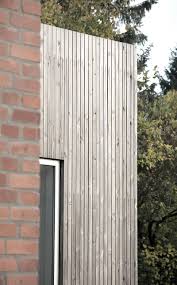 tvarno house small house with new extension old and new brick and pine kebony wood made by sortso arkitekter katoxvictoria fasade hus hytte