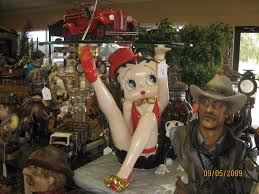An array of collectable betty boop's in all different attire and sizes. Betty Boop Table Chevy Ssr Forum