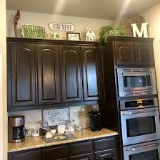 Have you ever wondered what to do with that awkward space above your kitchen cabinets? Boho Kitchen Decor Copper Kitchen Decor Country Kitchen Decor Cute Kitchen In 2020 Decorating Above Kitchen Cabinets Kitchen Cabinets Decor Above Kitchen Cabinets