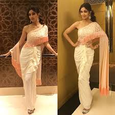 Have no ideas about new hair styling trends? 20 Divine Hairstyles To Complement Your Saree