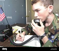 Civil Air Patrol Cadet Chief Master Sgt. Adam Taylor, of the Cleveleand  County Composite Squadron, mans a radio Thursday, Jan. 20, 2005, at the  McAlester Regional Airport in McAlester, Okla. The CAP