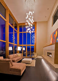 Elobarate Cascading Chandelier In Living Room With High Ceiling Chandelier In Living Room Oak Trim Living Room Design Modern