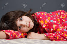 Check out this fantastic collection of cute desktop wallpapers, with 51 cute desktop background images for your desktop, phone or tablet. A Cute 9 Year Old Girl Lying In Colourful Pyjamas Looking Into Camera Grey Background Stock Photo Picture And Royalty Free Image Image 11712043