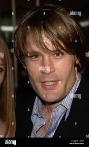 LOS ANGELES, CA. April 14, 2004: Actor SAM BELL & girlfriend at the Los  Angeles premiere of his new movie 13 Going