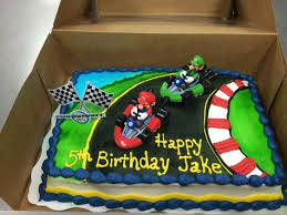 I'm sure the red shell tastes the best and the banana tastes like disappointment. 10 Mario Kart Cake Ideas Mario Kart Cake Mario Cake Mario Birthday Party