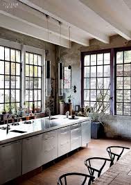 This industrial kitchen offers a dining table set for eight. Google Industrial Kitchen Design Loft Kitchen Kitchen Styling