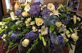 Casket spray purple and white funeral flowers. Funeral Cranbury Fields Flower Farm Cranbury Nj