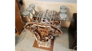 Pistons are showed off on both ends of the engine block and there is intricate pipe work in the base. How To Make A Car Engine Coffee Table Youtube