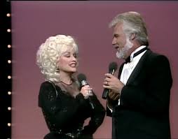 Dolly Parton and Kenny Rogers singing "Islands in the Stream", live at the  CMAs (in 1983). Today just happens to be Dolly's 77th birthday!