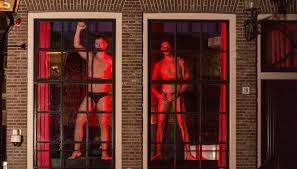 Male sex workers take over Amsterdams Red Light District windows