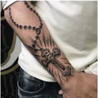 Engrave this unique blend of rosary and baseball to wish luck to the player. Rosary Tattoo Design On Forearm Entertainmentmesh