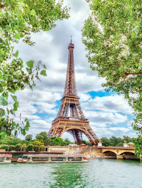 Classic View On Eiffel Tower Through Green Poplar Foliage Over ...