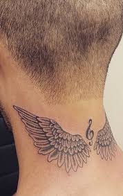 Small colorful baby angel tattoo on arm. 150 Divine Angel Wings Tattoos Ideas Meanings Tattoo Me Now