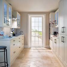 Glazed Wall Units Several Design Tricks Have Been Used Here As Well As Simple Clean Lines Of Ivory Cabinetry Kitchen Design Small Galley Kitchen Design Home
