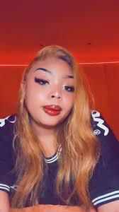 Vibrant Hair and Makeup Showcase in Red Lighting