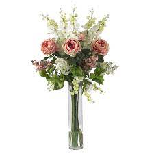 For the white vase arrangement, start adding the flowers one by one. Rose Delphinium And Lilac Silk Flower Arrangement Silk Specialties
