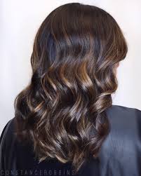 The blend of golden blonde tones with ribbons of chocolate brown. 60 Looks With Caramel Highlights On Brown And Dark Brown Hair Hair Highlights Black Hair With Highlights Golden Brown Hair