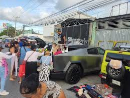 Model spotted flogging old clothes from fancy Cybertruck at flea market |  Need To Know