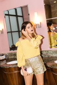 Maristella Wears A Gold Metallic New Year 39 S Eve Outfit Idea Perfect For The City Or The Beach With Sequin Shorts Off Nye Outfits Outfits New Years Outfit