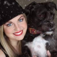 A woman holding a child in a bear costume. Mom son teddy bear, emotions.